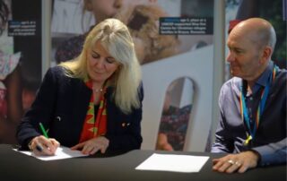 ■International Development Minister Carolyn Labey and Dr Philip Goodwin, chief executive at the UK committee for UNICEF, signing the agreement